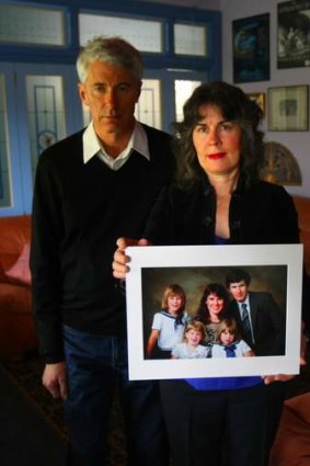 Anthony and Chrissie Foster with a family picture showing their two daughters Emma (back left) and Katie (front right) who were raped by Father Kevin O'Donnell.