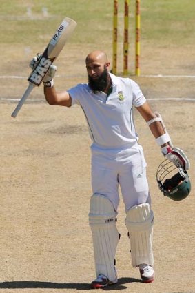 Hashim Amla waves to the crowd after reaching his ccntury on day four of the second Test.