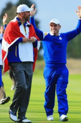 Team Europe captain Paul McGinley celebrates with Thomas Bjorn after Europe won the Ryder Cup.