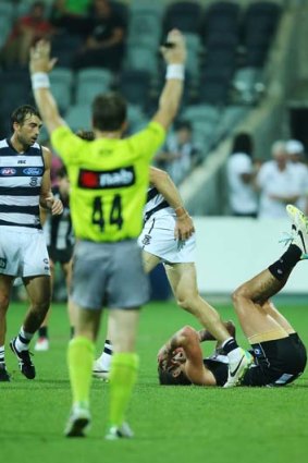 Jesse White of the Magpies reacts on the siren.