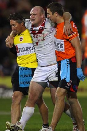 Anguish &#8230; Weyman is helped from the field on Monday night.