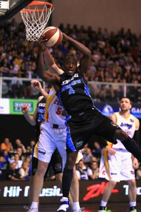 Cedric Jackson of the Breakers collects a rebound during the match against the Melbourne Tigers in Auckland.