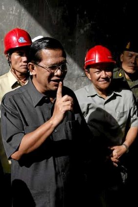 Prime Minister Hun Sen speaks to the media at a bridge construction site in Phnom Penh on Wednesday.