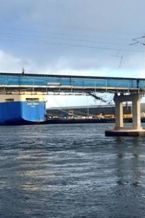 A ship hits the Fremantle Rail Bridge after a wild storm in Perth.