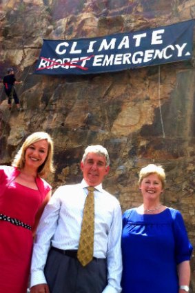 The Greens unfurled a banner on Kangaroo Point cliffs highlighting climate change. Pictured: Larissa Waters, Geoff Ebbs and Christine Milne.