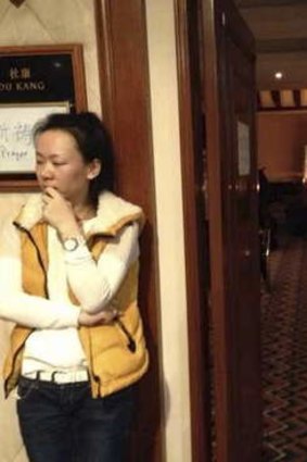 Family members of missing Malaysia Airlines flight MH370 pray for their loved ones at a prayer room at the Lido Hotel in Beijing.