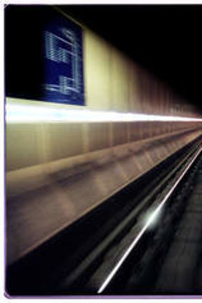 Commuters wait for trains at Melbourne Central.