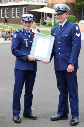 Calum McCann with Assistant Commissioner Lucinda Nolan.