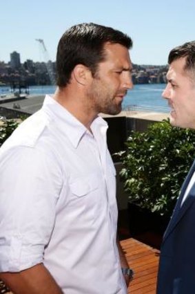 'Brutal' business: Luke Rockhold, left, and Michael Bisping stare each other down pre-fight.