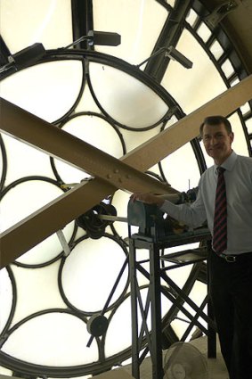 Lord Mayor Graham Quirk at the interior of one of Brisbane City Hall's clock faces.