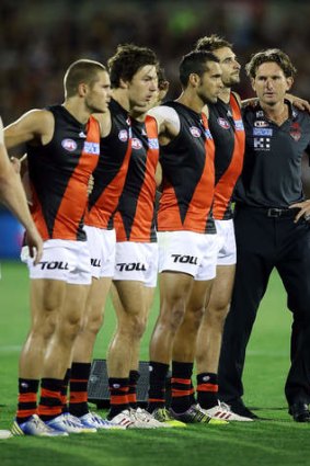 Bombers players and coach James Hird.