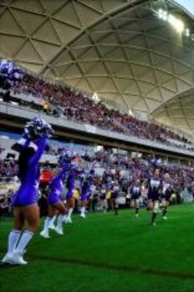 Melbourne Storm run onto the ground for their first match at AAMI park.