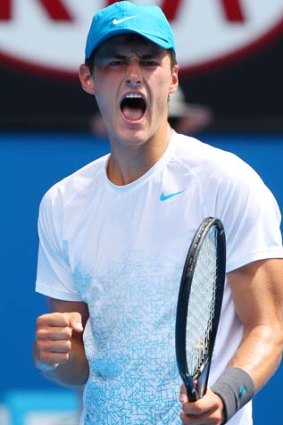 Bernard Tomic is through to the Australian Open's last 32 for the third consecutive summer.
