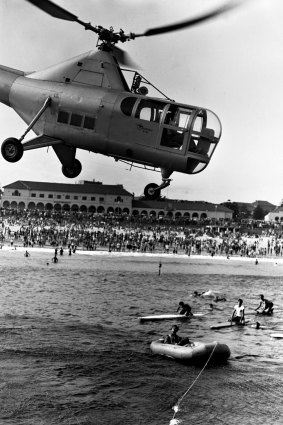 An RAAF helicopter in a rescue demonstration in 1948.