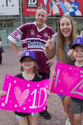 Keen: Alan and Claire Stokes with 1D fans Ellie Stacey, 6, and Charlotte Doyle, 5.