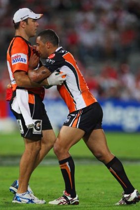 Heads up &#8230; Benji Marshall is attended to by trainer John Skandalis after a knock against the Dragons.