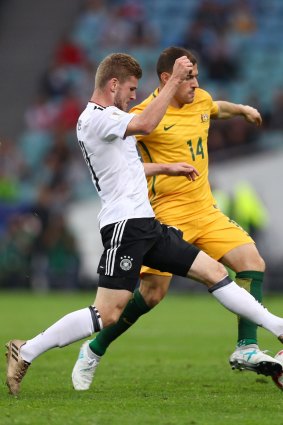 Socceroo James Troisi in battle against Germany.