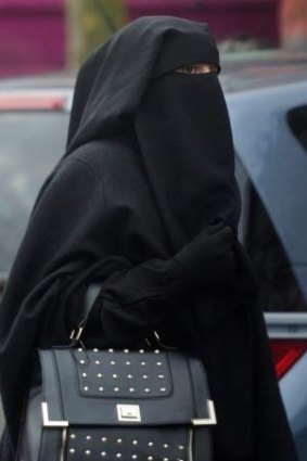 A Frenchwoman wearing a niqab in Roubaix in January. Hundreds of women have been fined for breaching France's controversial law since it was enacted in 2010.