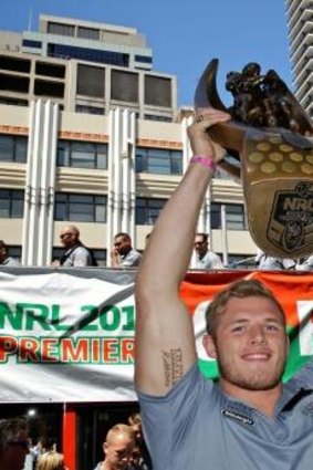 Tom Burgess holds the trophy high.