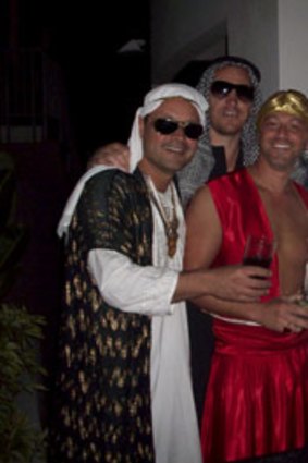 McIntyre (rear) with unidentified guests at the  fancy dress party.