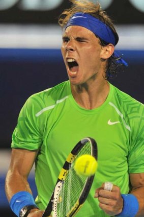 Marathon ... Rafael Nadal reacts while playing against Novak Djokovic .