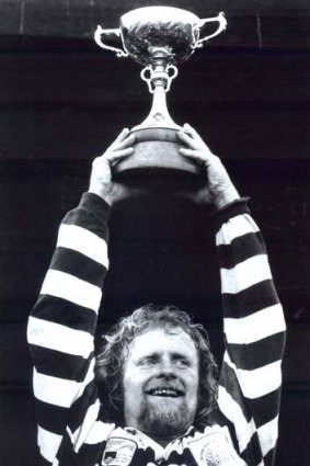 Laurie Fisher  holds the John I Dent Trophy aloft after ANU beat Royals in the 1992 ACT Rugby Union grand final.