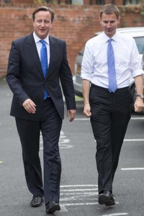 British Prime Minister David Cameron with Health Secretary Jeremy Hunt in Manchester, northern England, on Tuesday.