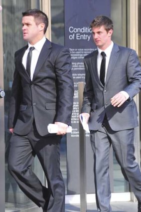 St Kilda footballers Adam Schneider and Andrew McQualter outside the County Court where they gave evidence at Andrew Lovett's rape trial.