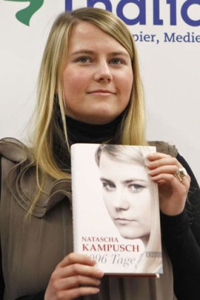 Natascha Kampusch with her book titled <i>3096 Days</i>.
