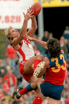 Speccy: Crowd pleaser Warwick Capper flies high for the Swans in 1991.