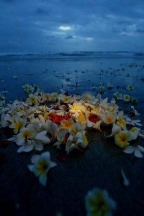 Not forgotten ... a floral tribute on Kuta Beach.