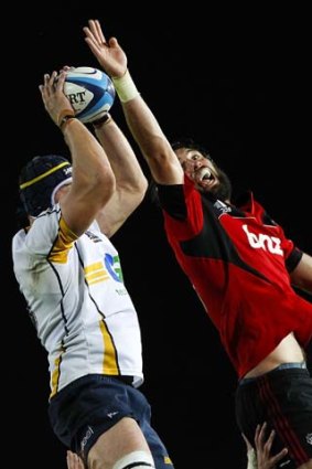 Sam Whitelock of the Crusaders competes for line out ball with Ben Hand of the Brumbies.