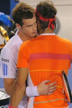 Farewell embrace ... Andy Murray and Rafael Nadal at the end of last night’s quarter-final.