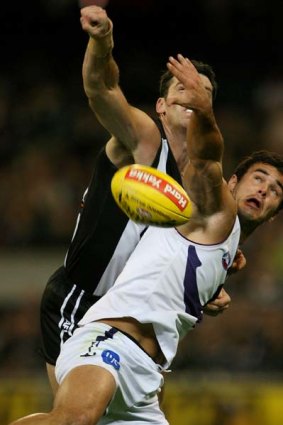 Fremantle's Chris Tarrant comes up against former teammate Simon Prestigiacomo in his first game against the Magpies, June, 2007.