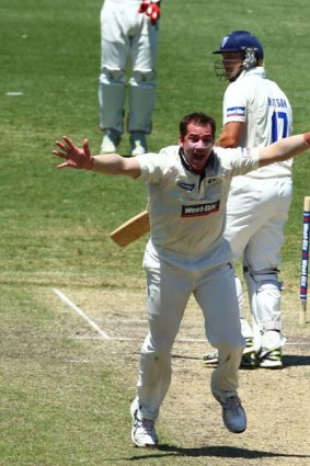Victorian bowler John Hastings celebrates the wicket of Shane Watson LBW at the SCG.