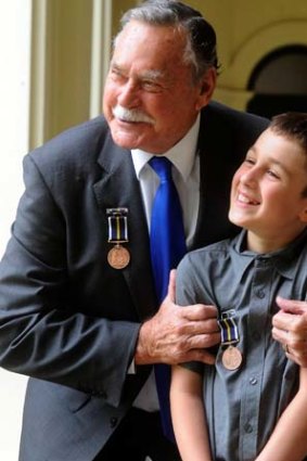 Courageous: Ron Barassi with Austin Millar, who saved his three-year-old brother, at the bravery awards