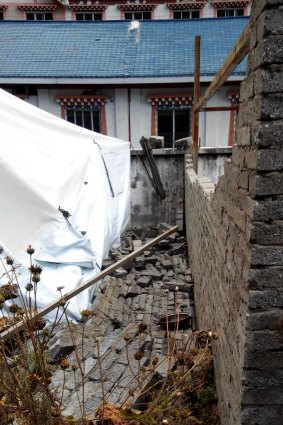 A wall at a hostel in Kangding, south-west China's Sichuan province, collapsed when the quake hit.