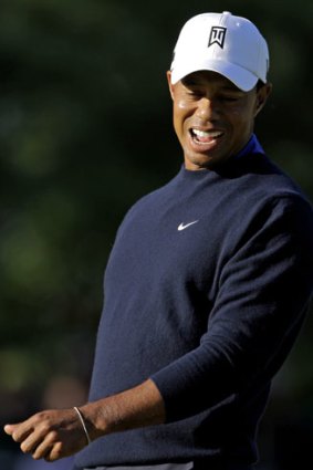 Tiger Woods shows his anguish at missing a putt.