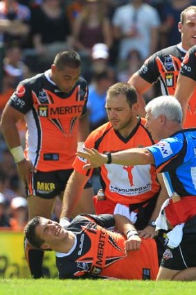 Season over &#8230; rookie James Tedesco writhes in pain.