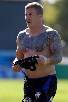 Dear to his heart: Trent Hodkinson's phoenix tattoo on his chest symbolises his journey back from career-threatening injuries.