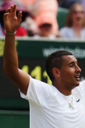 Nick Kyrgios celebrates his five-sets second-round win against Richard Gasquet of France.