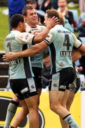 Top job &#8230; Cronulla's Colin Best, right, celebrates his try.