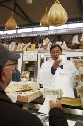 Say cheese: a cheese seller in Modena.