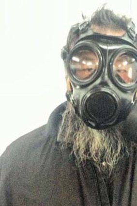 Extreme smog ... artist Ai Weiwei donned a gas mask for photos he posted on on Twitter.
