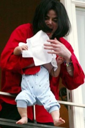 Shocking moment ... Jackson dangles his nine-month-old son out of a hotel window in Berlin in 2002.