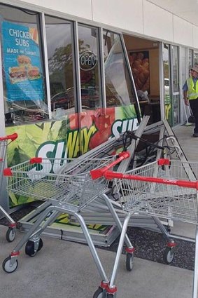 Three people were injured when a car crashed into a Subway store at Taigum.
