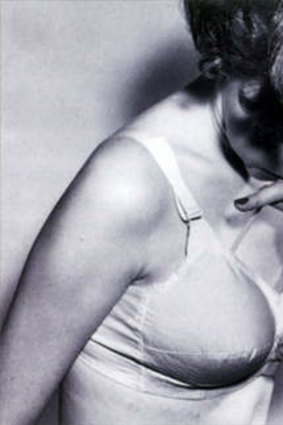 Retro pic of a woman wearing a bra.