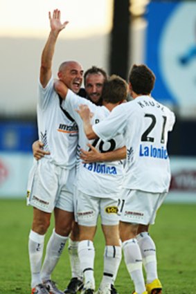 Melbourne Victory players celebrate Grant Brebner’s goal in the 2-1 win over the Mariners on Friday.