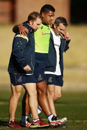 Scott Sio is assisted from the field in the Dubbo camp.