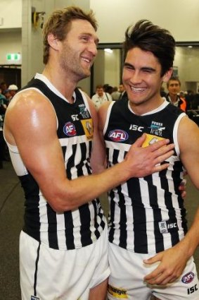 Too easy: Jay Schulz and Chad Wingard celebrate Port’s easy win over the Tigers on Sunday.